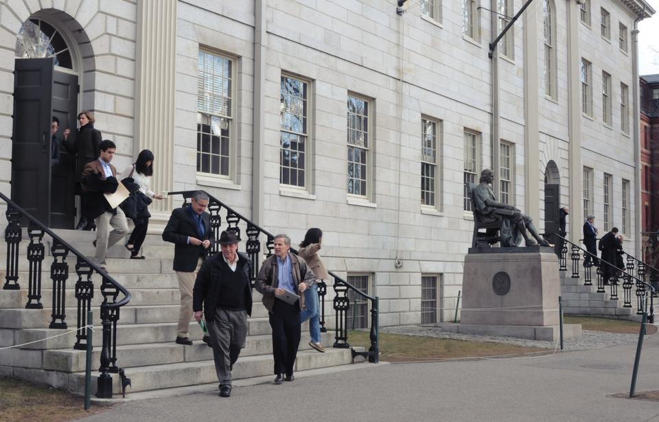 Faculty members leave University Hall after the faculty meeting on Tuesday.  
