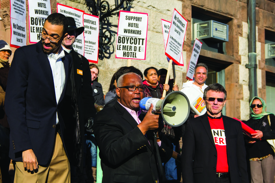 Cambridge City Council member Kenneth E. Reeves speaks out in support for the workers of Le Meridien Hotel. Harvard students joined the protest in front of Cambridge City Hall in support of allowing the workers at the hotel to join a union.