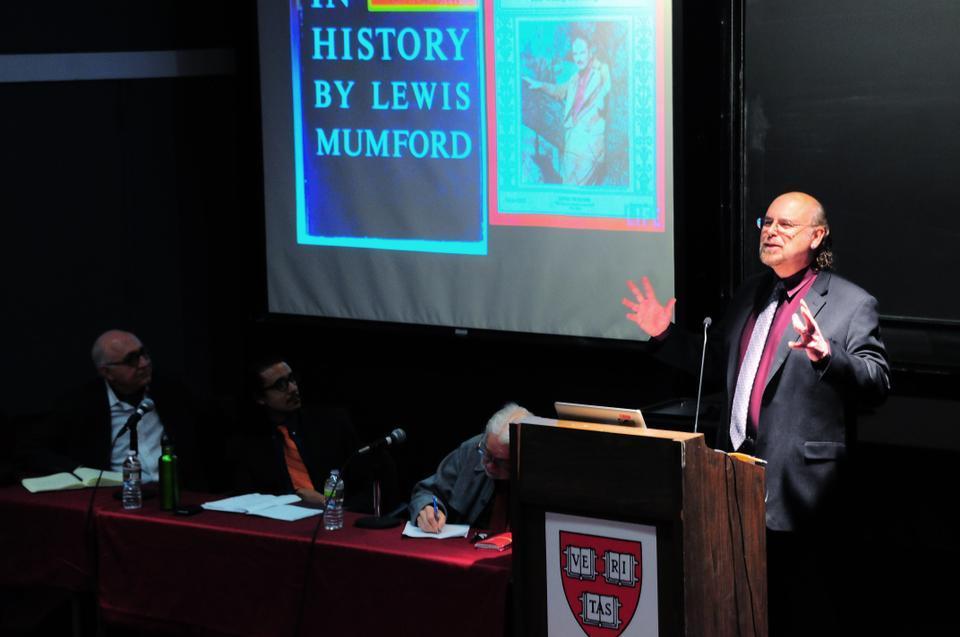 Professor Davíd Carrasco speaks about the richness of the history of Latin America at the Symposium on Urbanism, Spirituality, and Well-being. The interdisciplinary panel of academics shared their views on Thursday evening in Science Center Hall E.