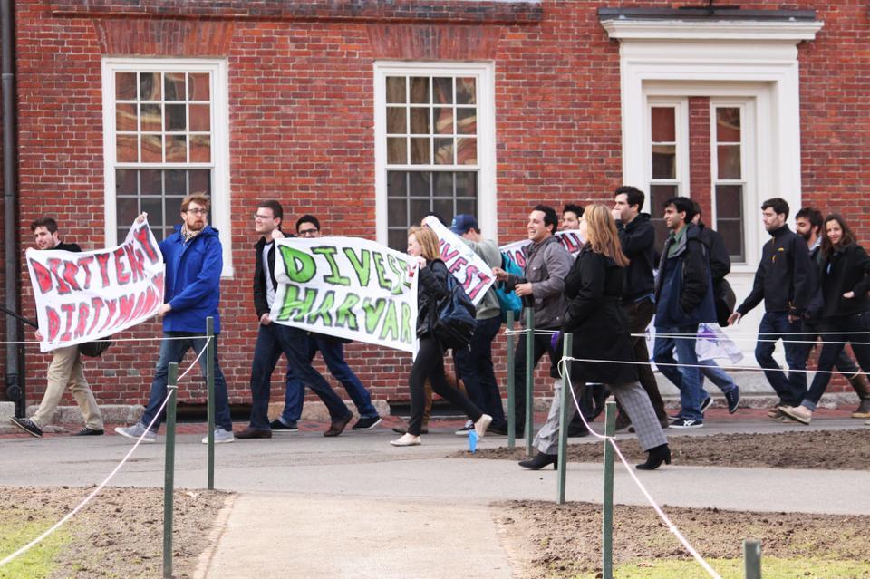 Thursday afternoon students assemble outside Massachusetts Hall to call for Harvard to divest from investments in Fossil Fuels.