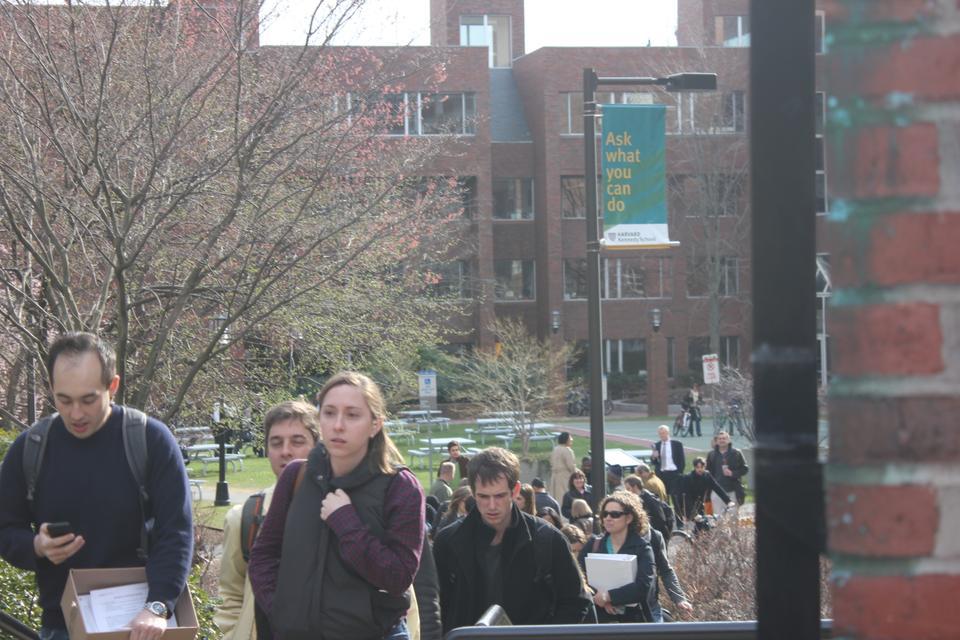 Kennedy School affiliates file out of the main campus of the school. Two bomb explosions at the end of the Boston Marathon sparked turmoil throughout the Boston area.