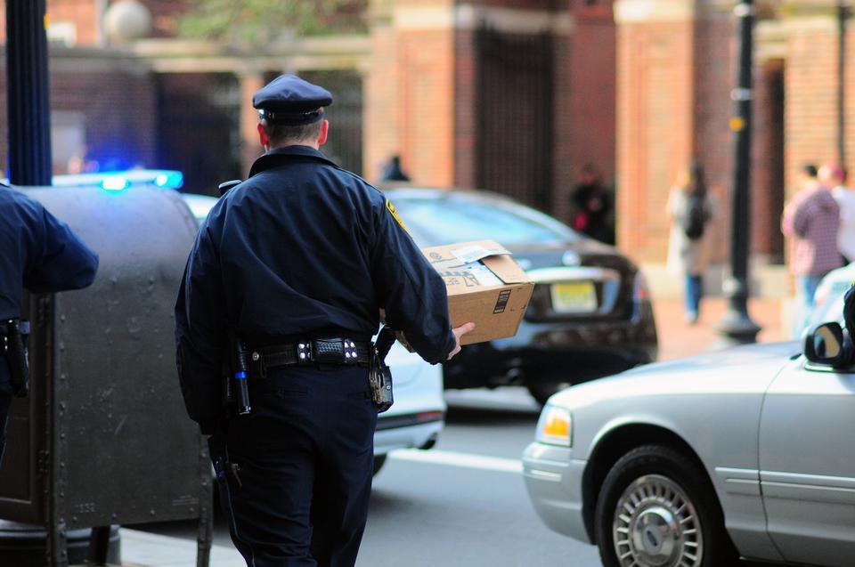 A HUPD police officer carries a "suspicious package" from Quincy swing housing to his vehicle. Police officers were called to the scene Monday afternoon after the package was reported waiting in the foyer of the Mass. Ave. building.

This caption has been revised to reflect the following correction:

CORRECTION: April 17, 2013

An earlier version of this caption incorrectly identified the officer as a member of the Cambridge Police Department. In fact, he is a Harvard University Police Department officer.