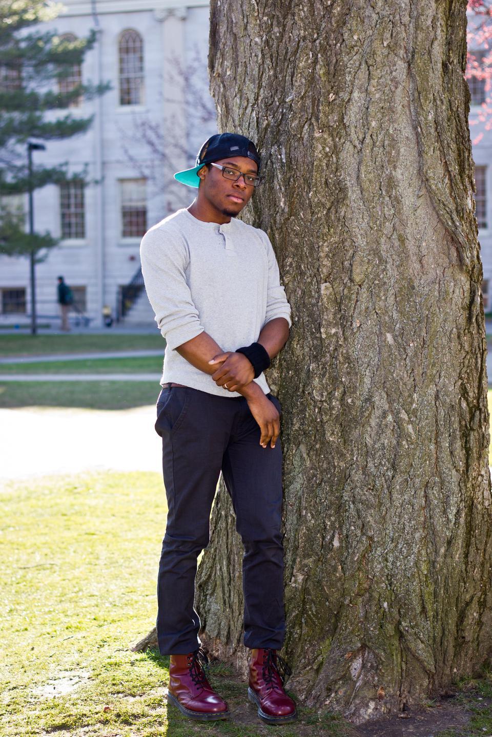 Jay Drummond’15 poses next to a tree.