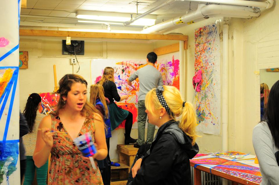 Sarah Moon ‘15, the co-founder of Cabot Arts Space, talks to the attendees at its opening on April 12. 