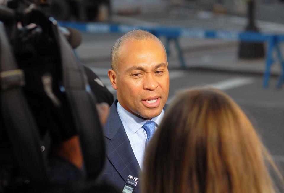 Governor Deval Patrick speaks to the press in front of the Westin Copley Place hotel on Wednesday.  In his statement, he informed reporters that the subsequent investigation will be 'slow and methodical'.