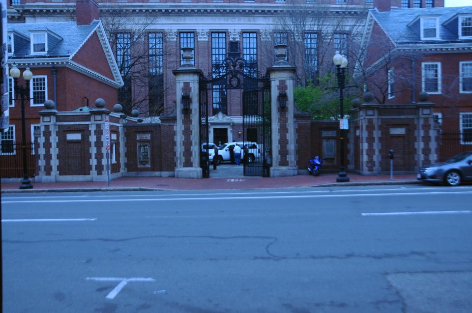 The gate to Harvard Yard remains open Friday morning as security officials consult with one another. In an email to students, Dean of the College Evelynn M. Hammonds promised "a heightened security presence."