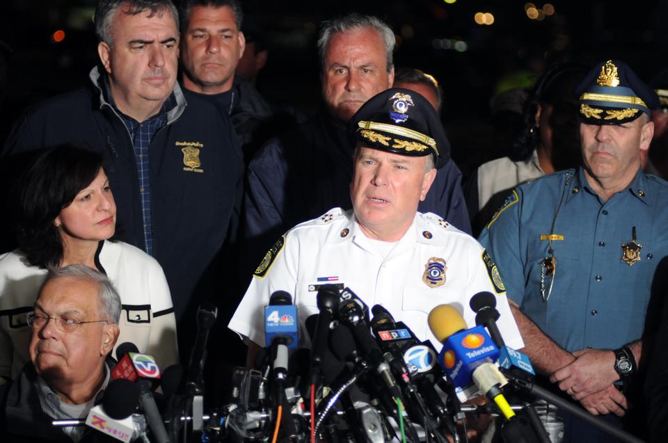 MBTA Transit Police Department Chief Paul MacMillan addresses the media on Friday evening. MacMillan reported that Richard Donahue Jr., the transit police officer injured earlier in the day, was in stable condition.