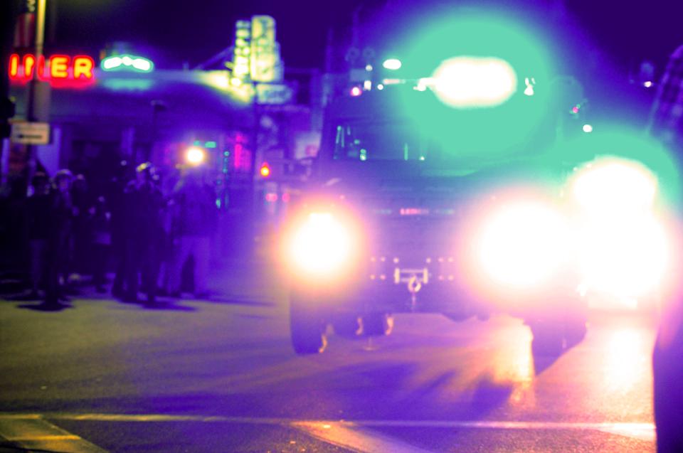 A Humvee drives down Mt. Auburn St. before cheering crowds shortly after the announcement that Dzhokhar Tsarnaev was apprehended by authorities Friday evening in a Watertown backyard. 