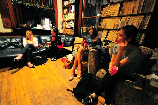 Kristen DePre '13 (lft) talks with students in The Advocate as a part of the Cabot Literary Salon series. Guests enjoyed wine and food while discussing DePre's thesis on art dealers of the 20th century and the demise of the 19th-century salon. 