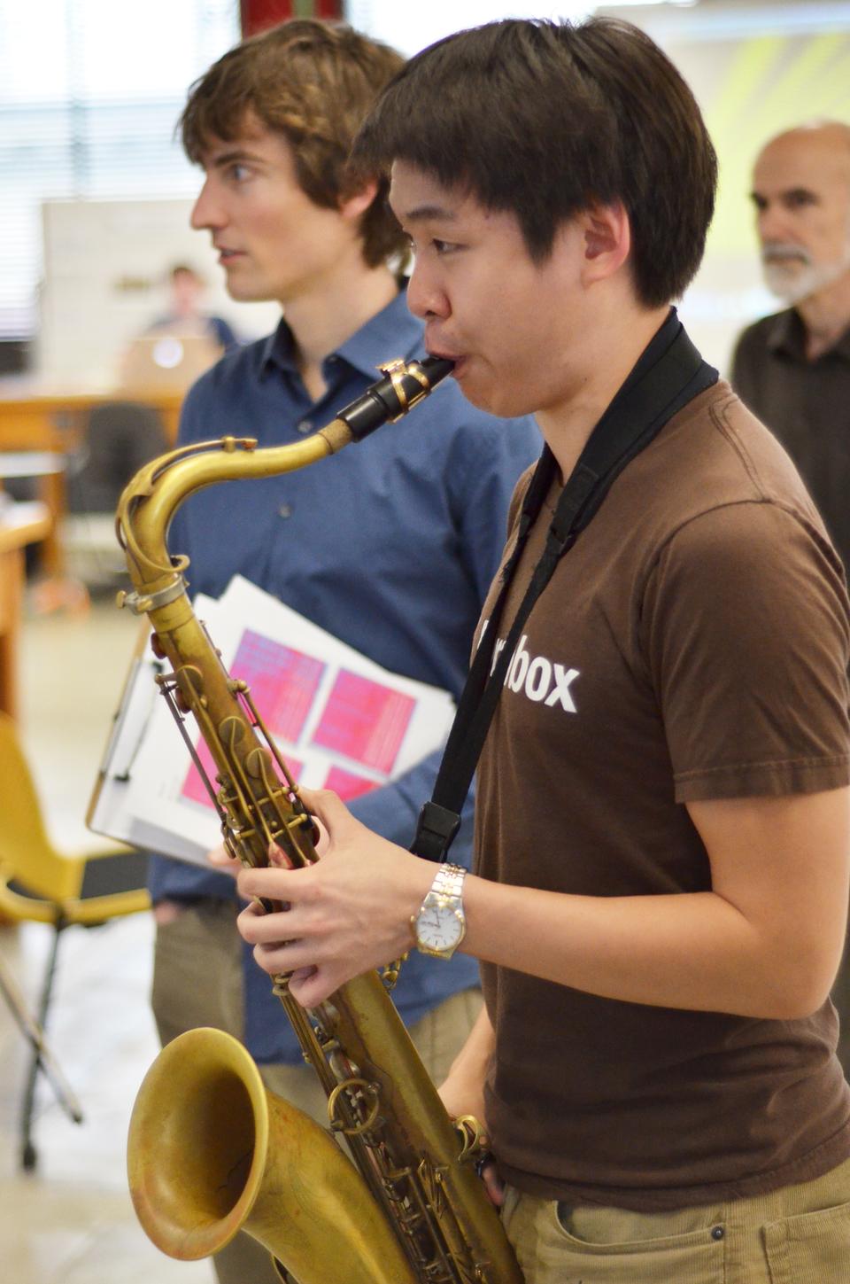 Kevin Sun '14 simultaneously plays the saxophone and sings to show a visual representation of music at the Sound Fair. The Sound Fair took place on the third floor of the Science Center on Thursday afternoon and it showcased the final projects of SPU 13: Why You Hear What You Hear.