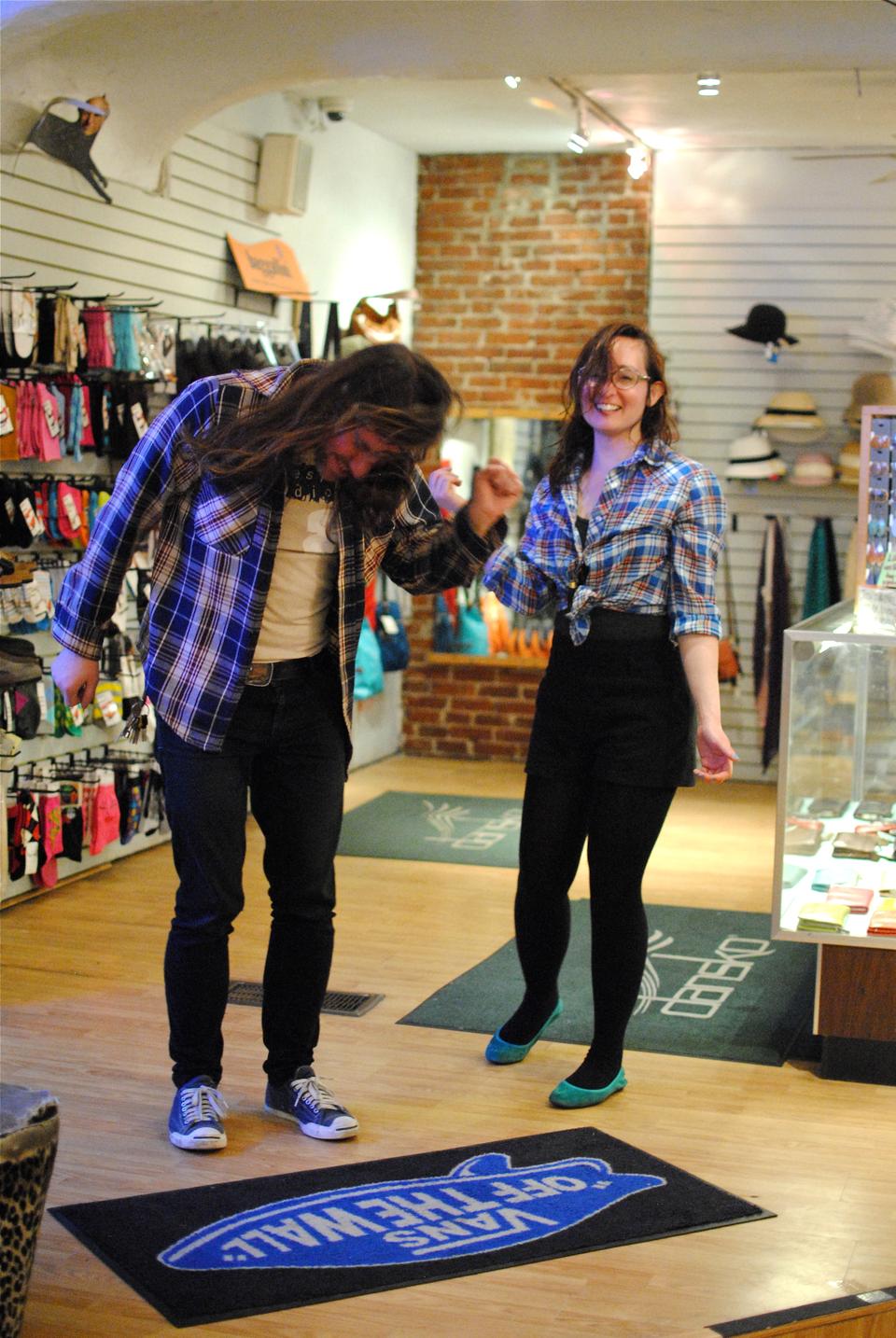 Mikey, left, dances with his co-worker in Berk’s Shoes & Clothing after opening their shop late on April 19. They celebrated the capture of marathon bombing suspect Dzhokhar Tsarnaev and the lockdown lift across Boston. 