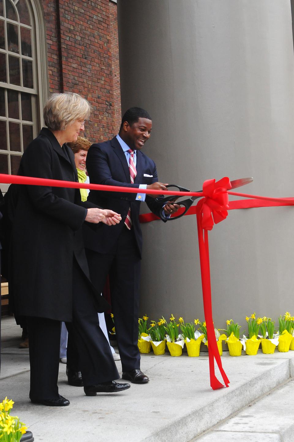 University President Drew Faust watches as new Memorial Church minister Rev. Jonathan L. Walton opens the Porch on the church steps on April 24. 