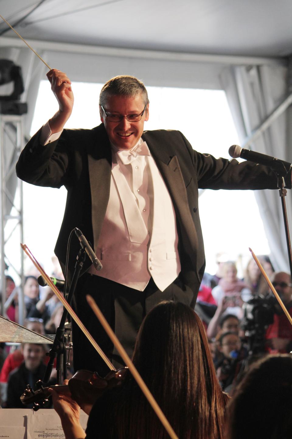 Professor N. Gregory Mankiw, chairman of the Economics department, conducts the River Charles Ensemble in the Science Center Plaza during the Arts First Festival on April 27.