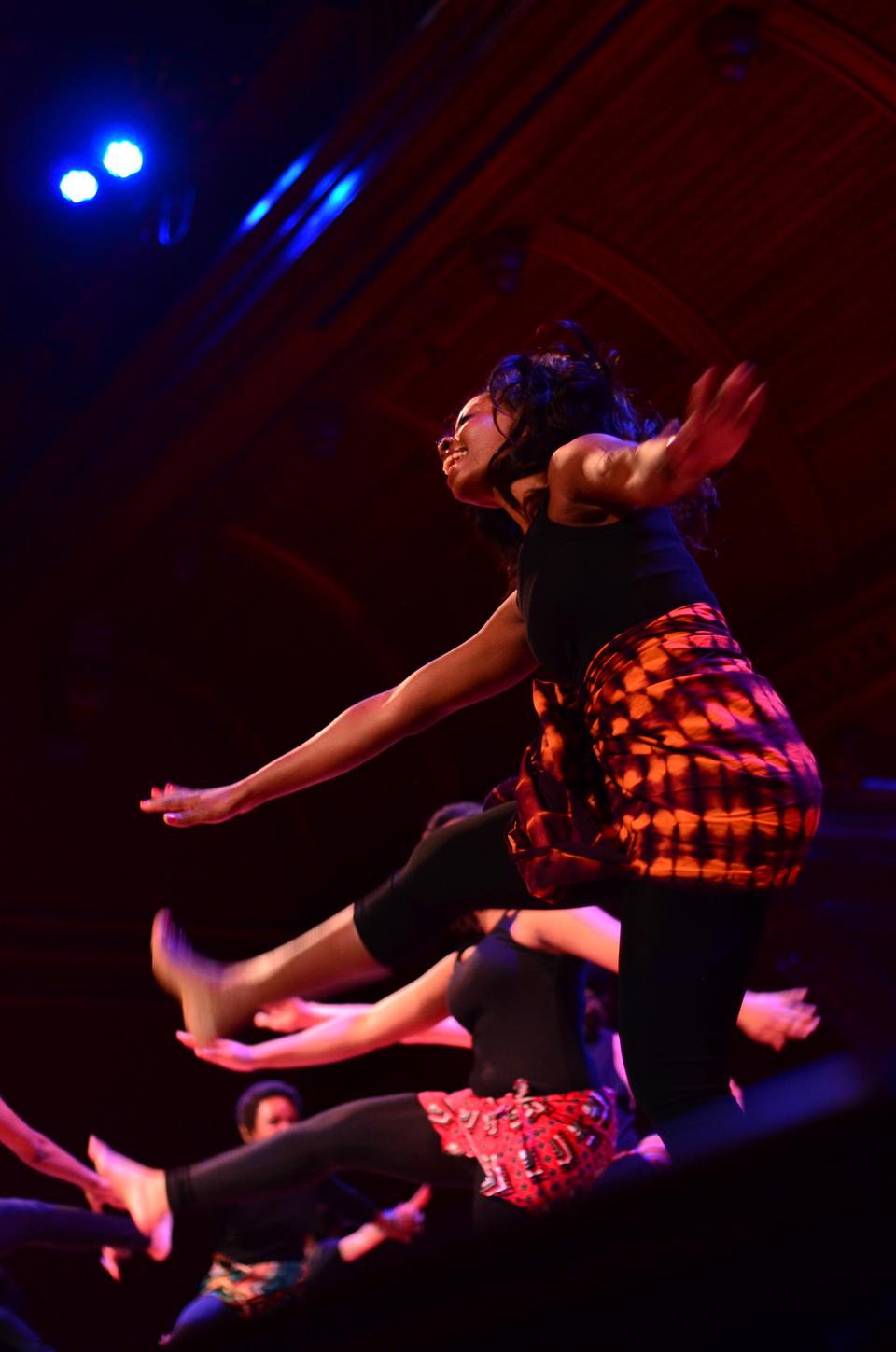 A member of the Pan-African Dance and Music ensemble breaks out into a smile during the afternoon show of Cultural Rhythms on February 23.