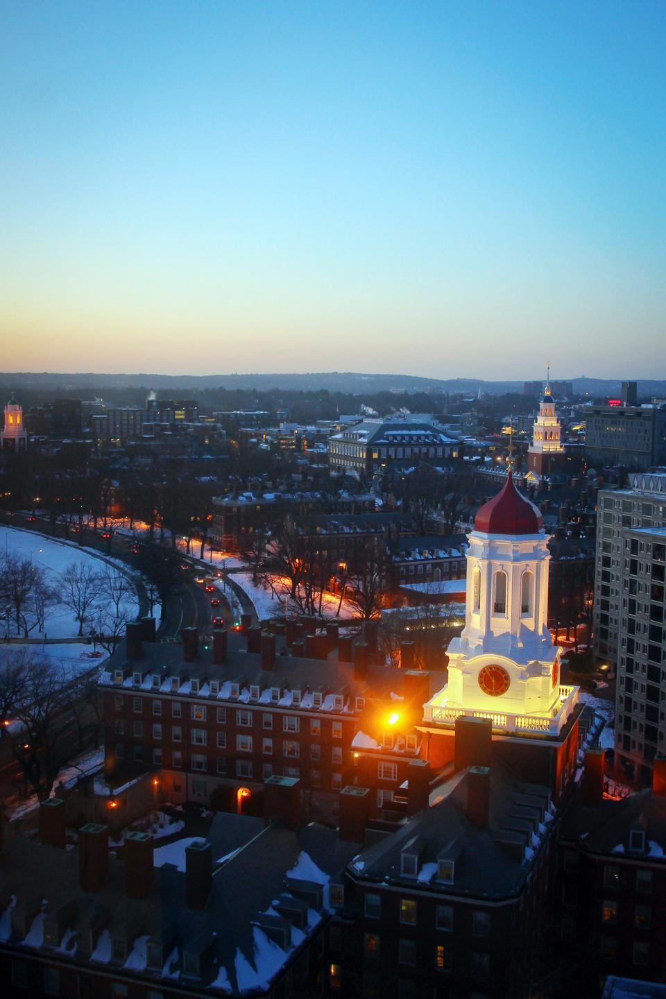 Dunster House lights up the skyline along Memorial Drive and the Charles River. In its March 14 issue, FM highlighted house life at Harvard.