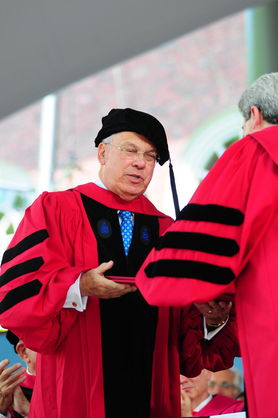 Boston's longest-serving mayor Thomas M. Menino receives an honorary Doctor of Laws degree during morning exercises on Thursday.