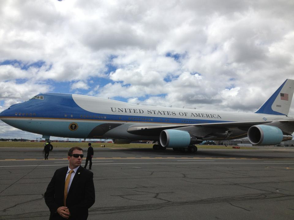 Officers look on after Air Force One touches down at Boston Logan International Airport Wednesday. President Barack Obama visited the city to speak at a rally for U.S. Rep. Edward J. Markey, the Democratic nominee for the state's open Senate seat.