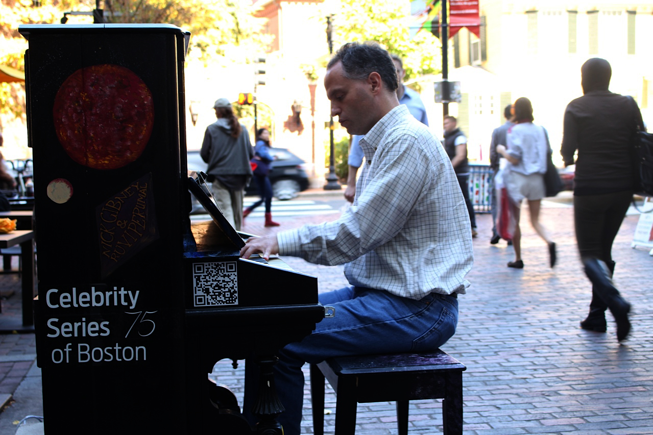 Harvard researcher, Stephen Leroy plays at the piano in front of Au Bon Pain last Friday.  Stephen is one of the many people who have enjoyed using the street pianos throughout Cambridge. 