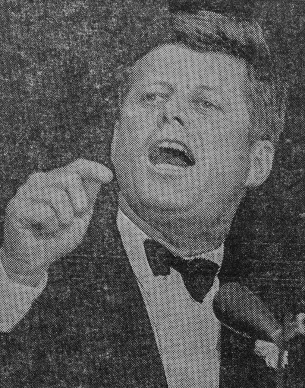 President John F. Kennedy '40 speaking at Boston's Commonwealth Armory on Saturday, Oct. 19, 1963, after attending the Harvard-Columbia football game. This photo ran on the front page of The Crimson on Monday, October 21, 1963, just a month before the President's assassination.