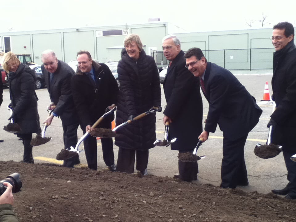 University President Drew G. Faust, third from left, and Boston Mayor Thomas M. Menino, third from right, join Allston community members on Friday to ceremonially break ground on Barry’s Corner Residential and Retail Commons.
