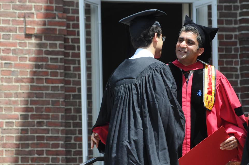 Cabot House co-master Rakesh Khurana, who will become Dean of the College on July 1, is pictured greeting a graduating senior during 2012 Commencement.