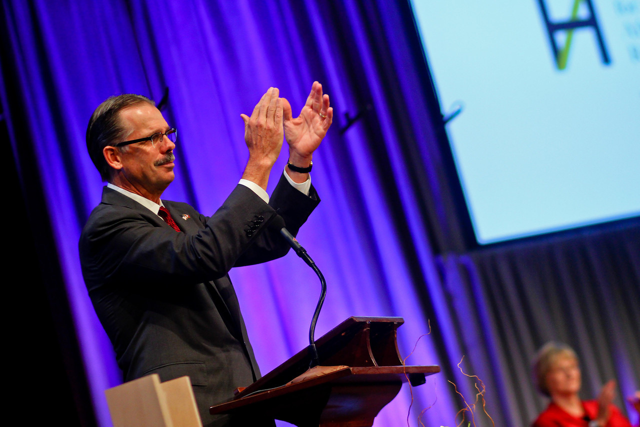 Glenn H. Hutchins '77, a leading University donor and co-chair of the Harvard Campaign, applauds medalists at the W.E.B. Du Bois Medal ceremony in  October 2013.