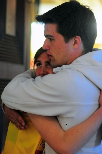 Ginny C. Fahs ‘14 and Mark R. Jahnke ‘13 embrace at a reception held for the Harvard College Marathon Challenge participants in Quincy Junior Common Room on Monday evening. Both runners, who walked back to Harvard’s campus, had made it past the 26-mile mark when authorities closed the route due to detonation of two bombs at the finish line.