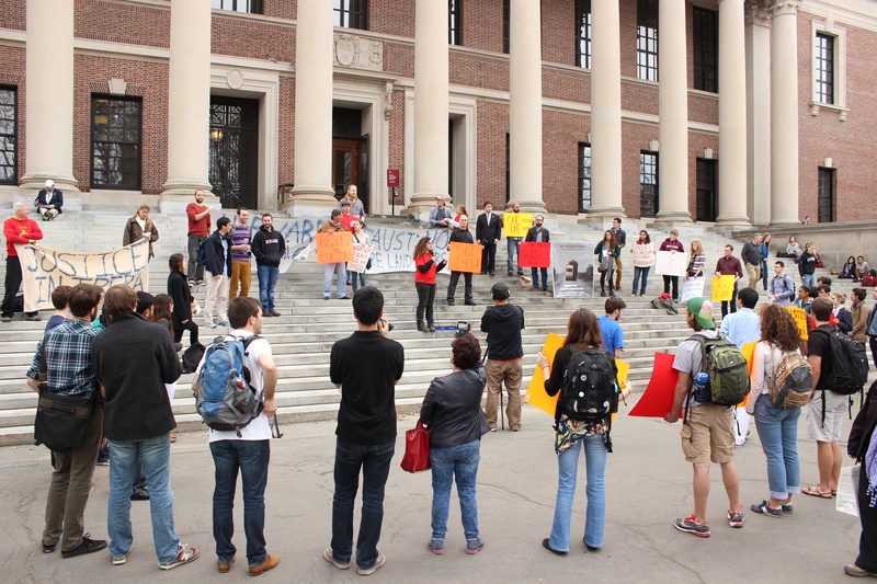 Students advocating for responsible investment tactics protest on the steps of Widener Library. 