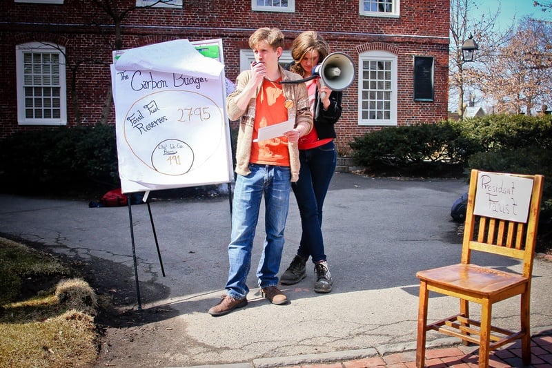 Benjamin Franta, a Harvard Graduate School student, and Alli J. Welton '15 discuss the carbon budget and fossil fuel reserves at their rally in Harvard Yard on March 11, 2014.