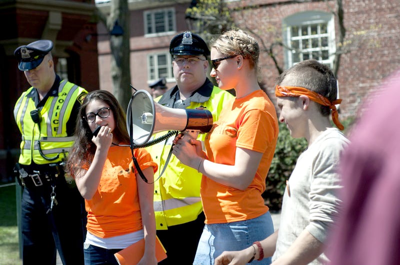 Members of Divest Harvard, including Brett A. Roche '15, far right, who was arrested during a protest two days prior, returned to Massachusetts Hall on May 2, 2014 to renew their call for an open meeting with the Harvard Corporation.