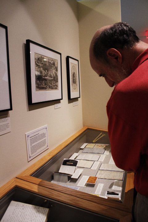 Visitors amble around historic artifacts of the Civil War era showcased on Wednesday in the Knafel Center. The opening of the 'What They Wrote, What They Saved: Personal Civil War' exhibition showed history enthusiasts rare diaries and letters written by ordinary people in the 1850's.