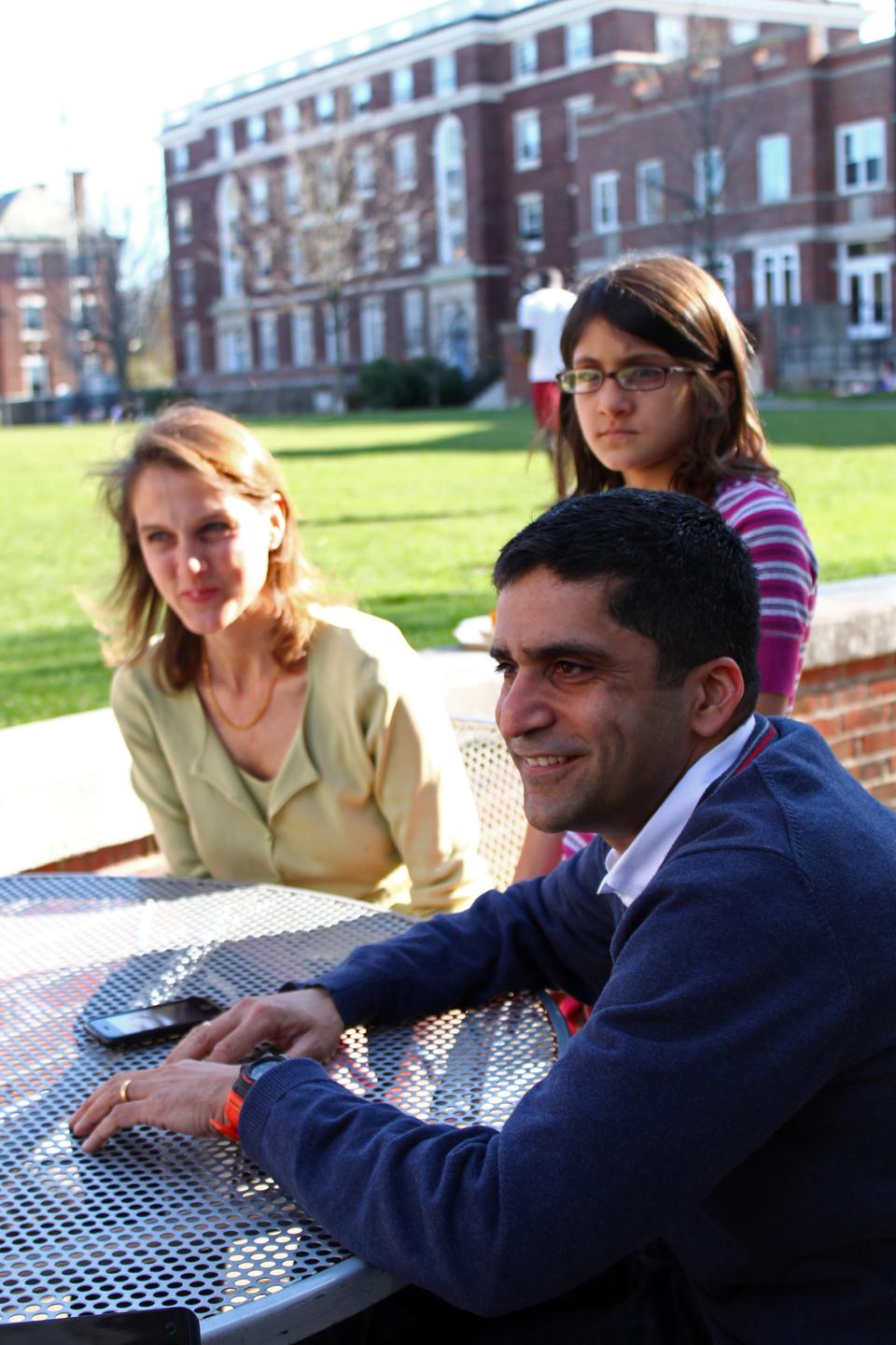 Current Dean of the College and Cabot House Master Rakesh Khurana sits with his daughter and wife, Stephanie, in 2010.