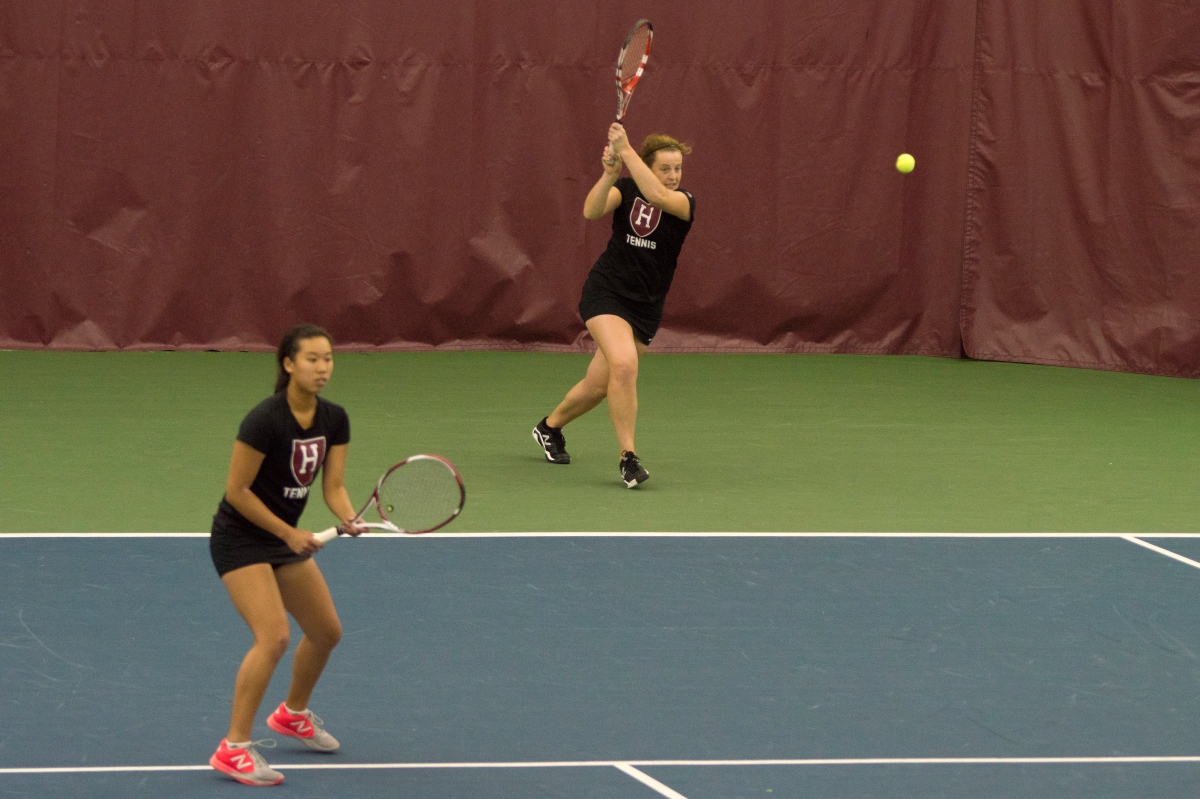 The Harvard women’s tennis team, shown here in previous doubles action, sent six competitors to the ITA Regional Championships. Sophomore June Lee advanced into the semifinals of the singles division.
