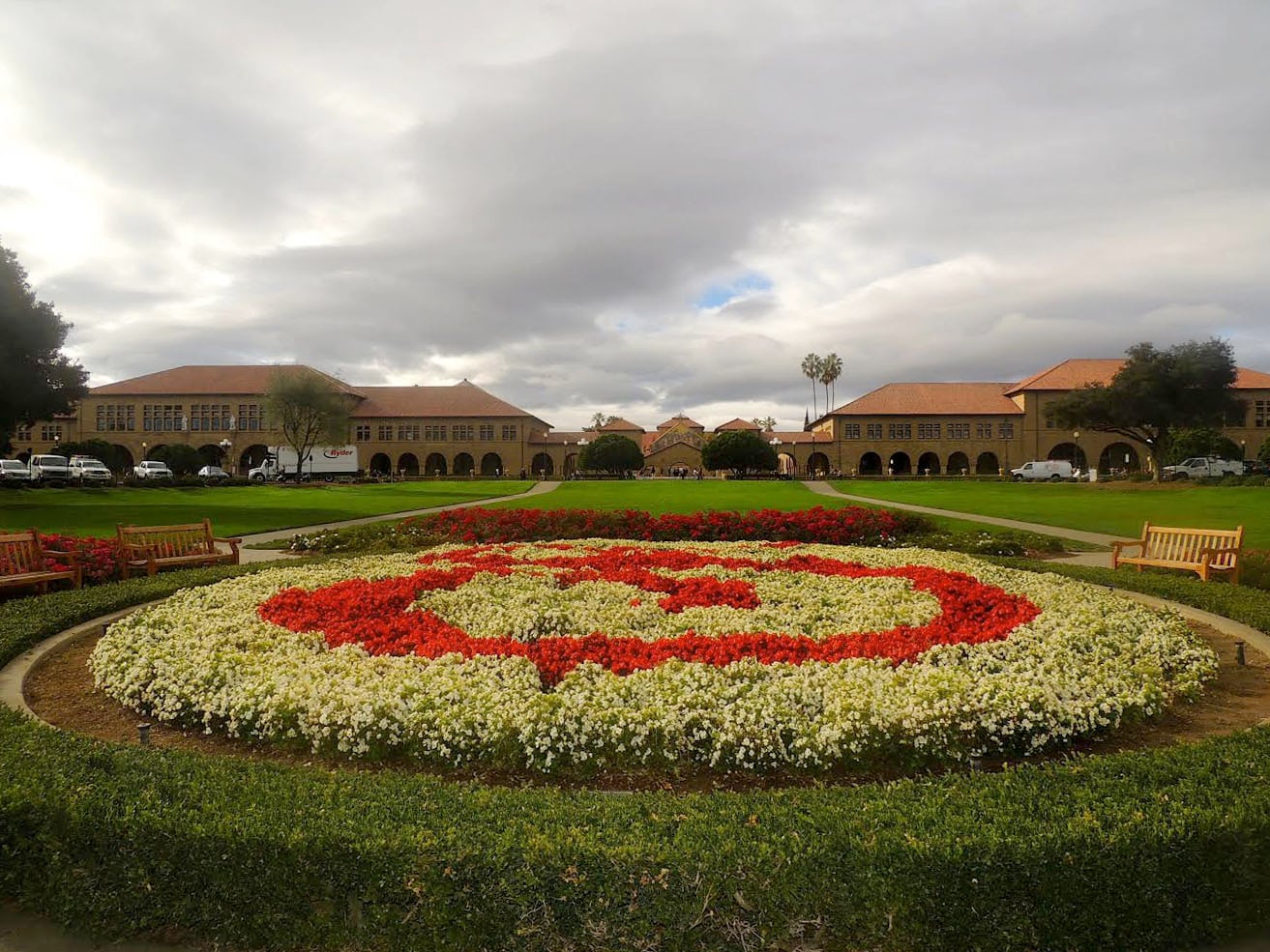 The Oval, a floral garden that features the cardinal "S" logo of Stanford University, marks the official visual entrance to the campus.