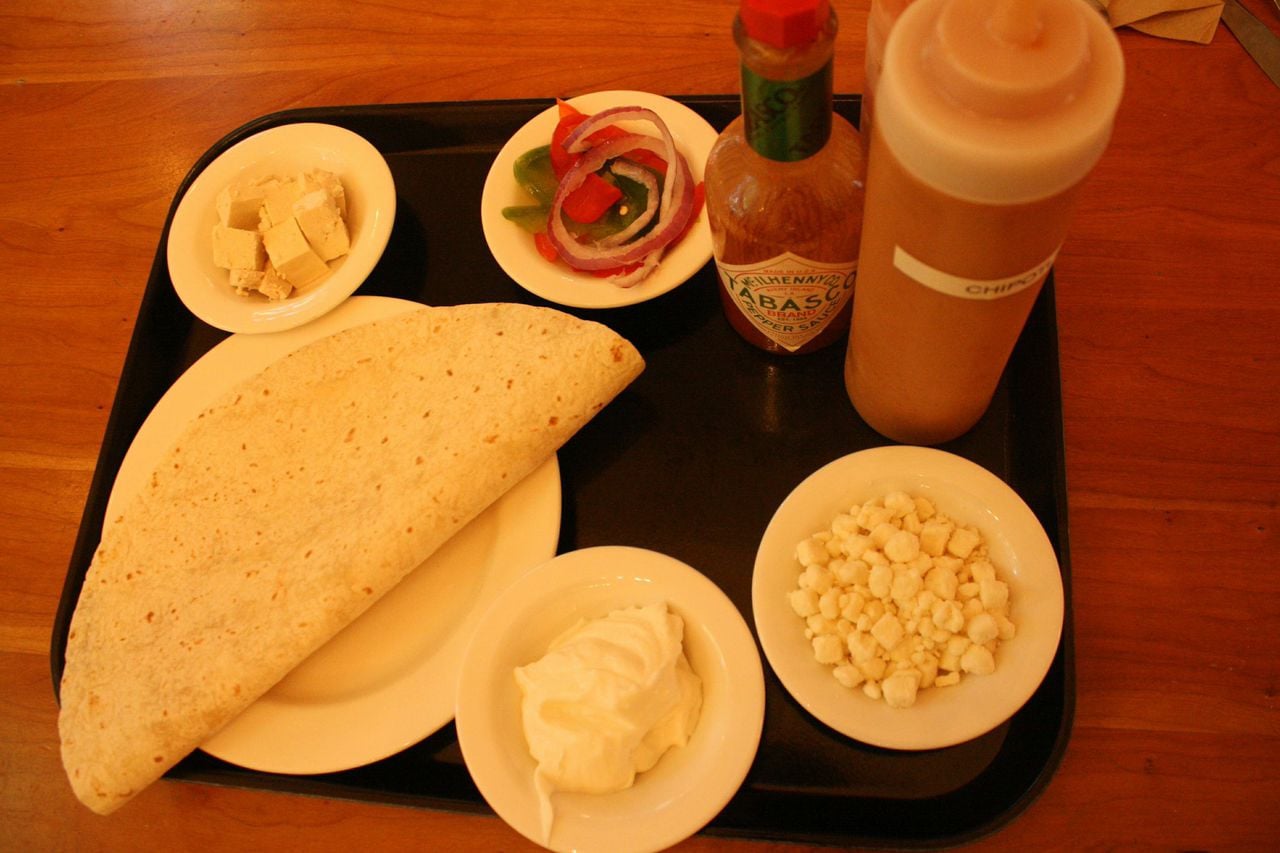 Ingredients:
1 large tortilla, whole wheat or white
1 small bowl feta
1 small bowl tofu
1 small bowl chipotle mayonnaise
1 small bowl hot sauce
1 small bowl Greek yogurt
Handful of pepper and red onion slices