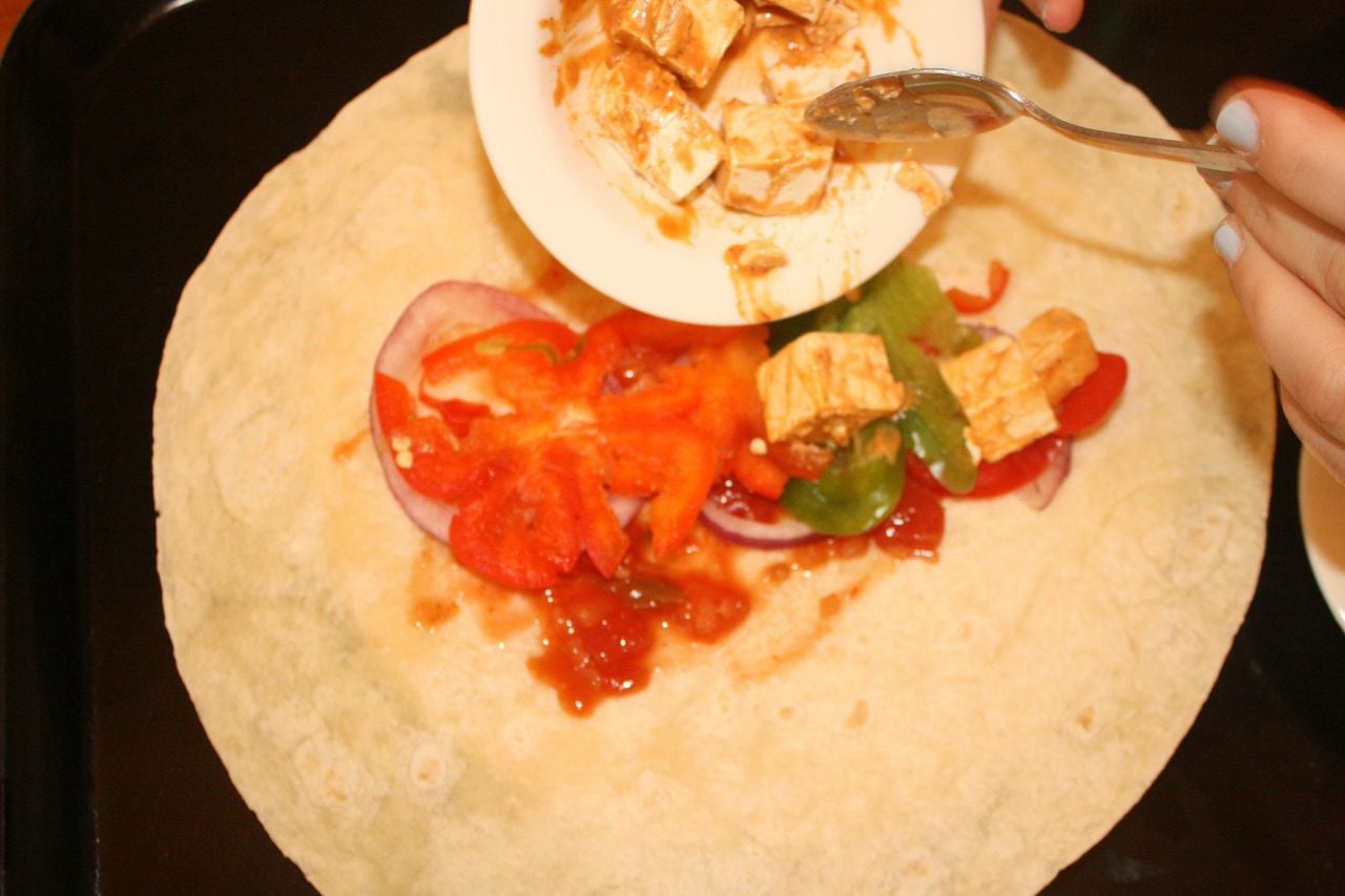 Dollop a generous helping of the hot sauce and tofu mix on top of the peppers