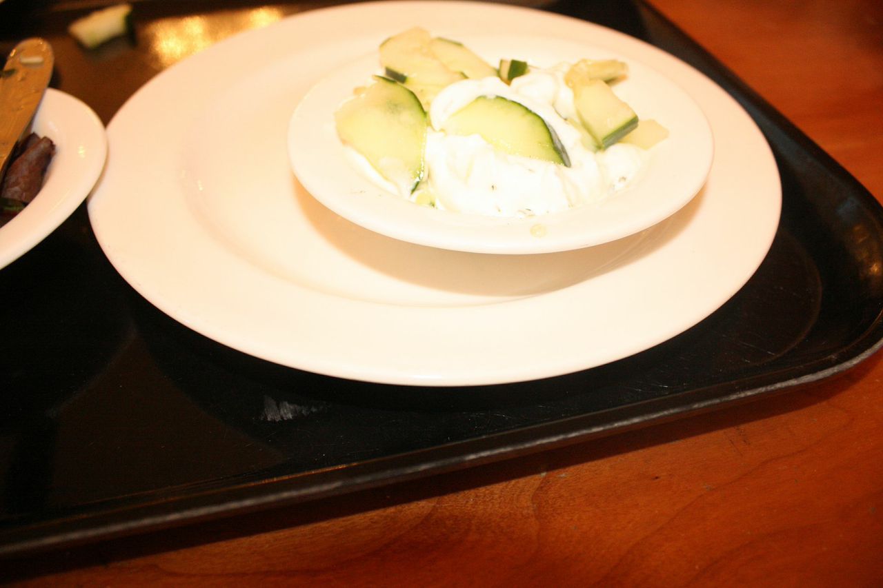 Stir Greek yogurt to mix in the dill. Add cucumber slices, mix