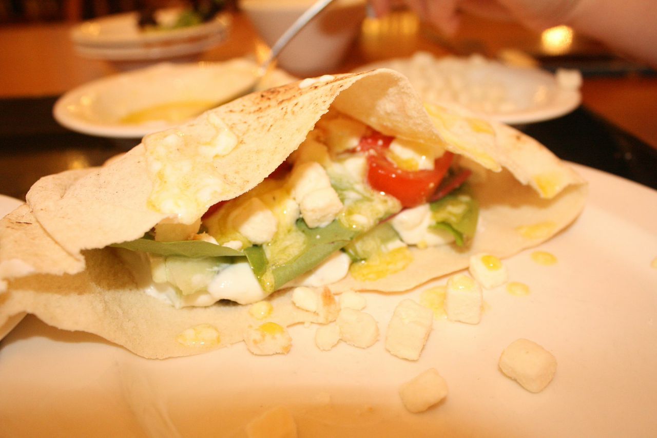 Pour mixture over contents of pita