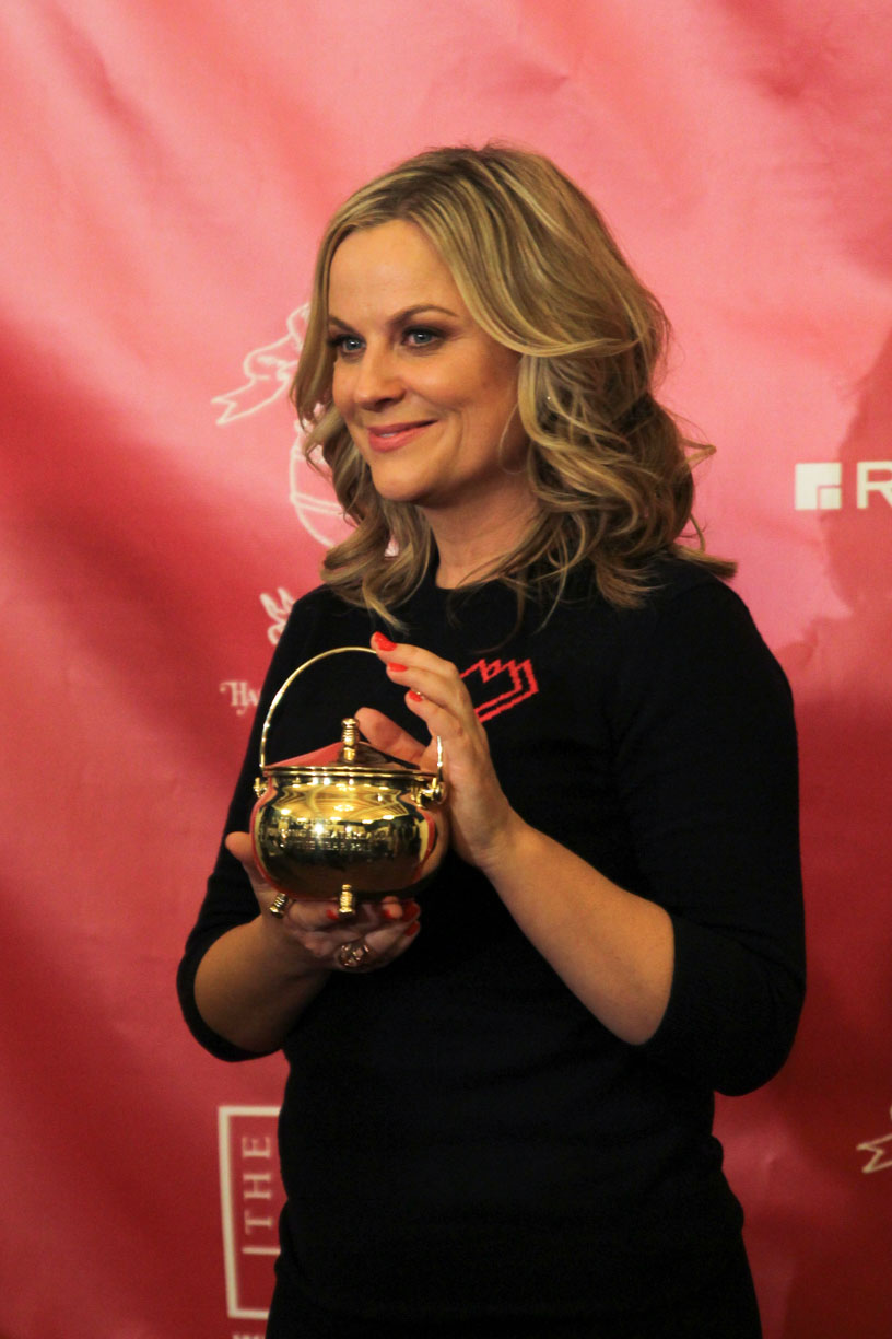 Amy Poehler accepts the Hasty Pudding Pot from the Hasty Pudding Theatricals as the 2015 Woman of the Year on Thursday afternoon.  