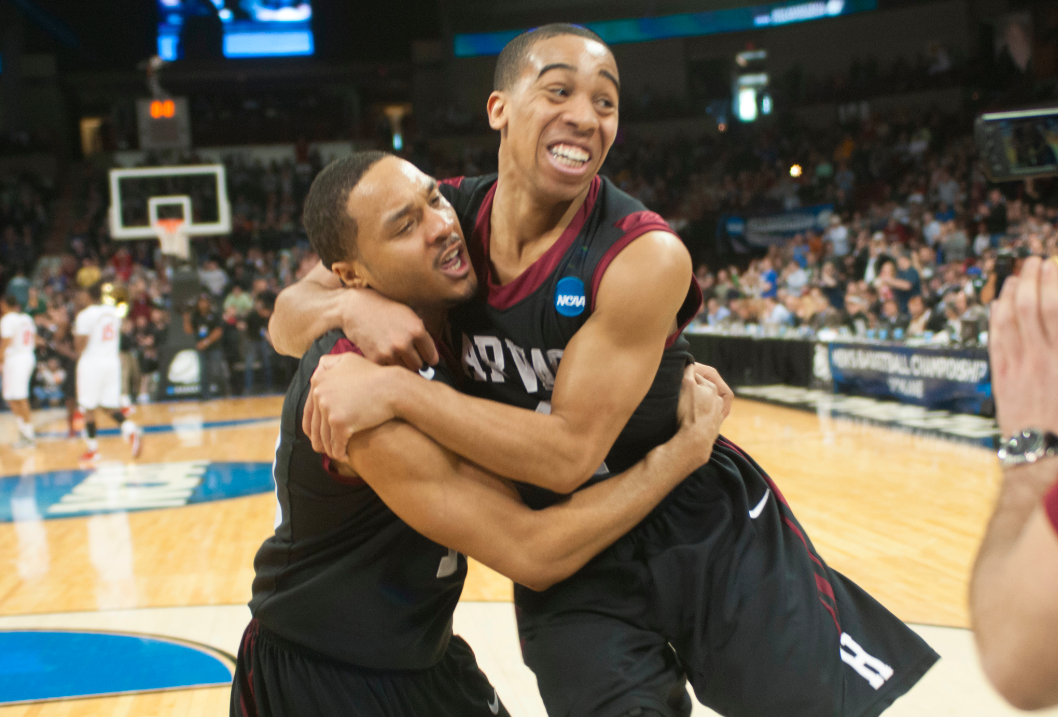 Former co-captain Brandyn Curry ’13-’14, left, was traveling through Holland when he heard the news that the Crimson was going to the NCAA Tournament once more.
