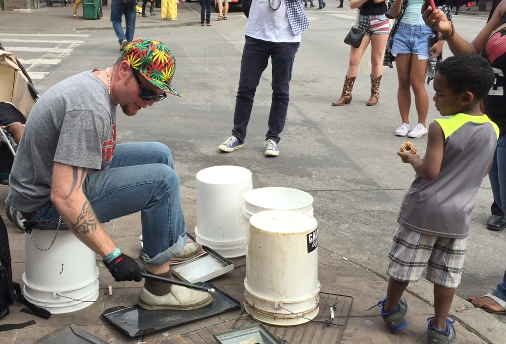 Music spills onto the sidewalk in Austin, Texas during the South by Southwest festival. This duo attracted a crowd one afternoon in the street. 