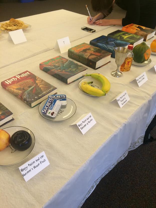 Books including "Harry Potter and the Goblet of Fireball" are lined up on the table for participants to look at. Lamont Library held the Edible Book Contest on Wednesday. 