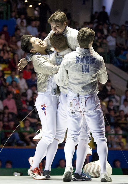 Dershwitz and his American teammates celebrate Dershwitz's victory at the Junior World Championships in Tashkent, Uzbekistan.