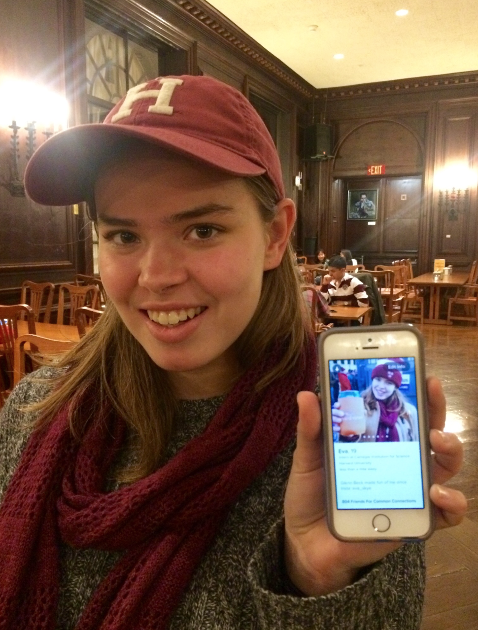 Eva poses with her online dating profile. 