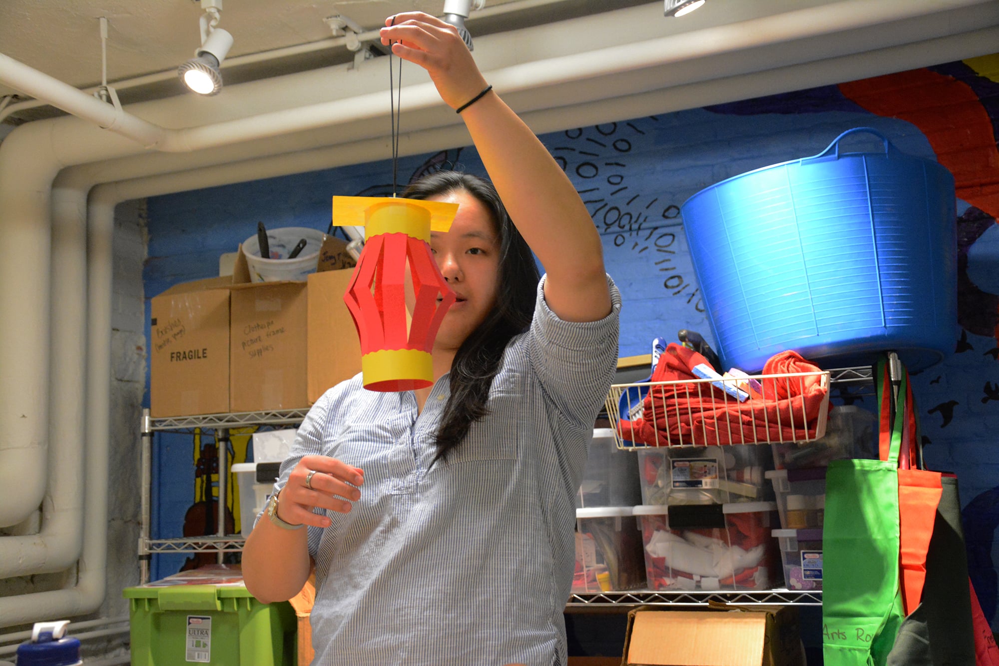 Enya Huang ‘19 crafts a paper lantern to celebrate the Chinese Spring Festival  in the Freshman Arts Room on Wednesday.