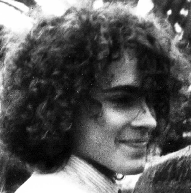 This image is "around sophomore year of high school, pre-pony tail."