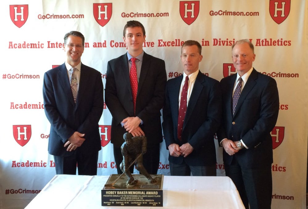 Jimmy Vesey (second from left) is the fourth player in Harvard history to win the Hobey Baker Award, joining Lane MacDonald '88-'89 (left), Scott Fusco '86 (second from right), and Mark Fusco '83 (right). The four winners were honored Monday night at the Downtown Harvard Club of Boston.