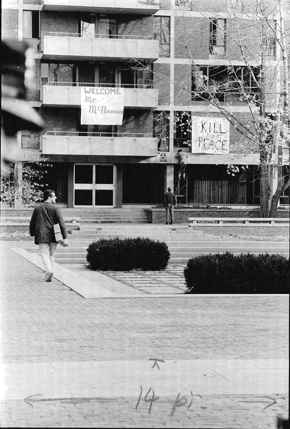 Quincy House draped in anti-war bedsheet banners