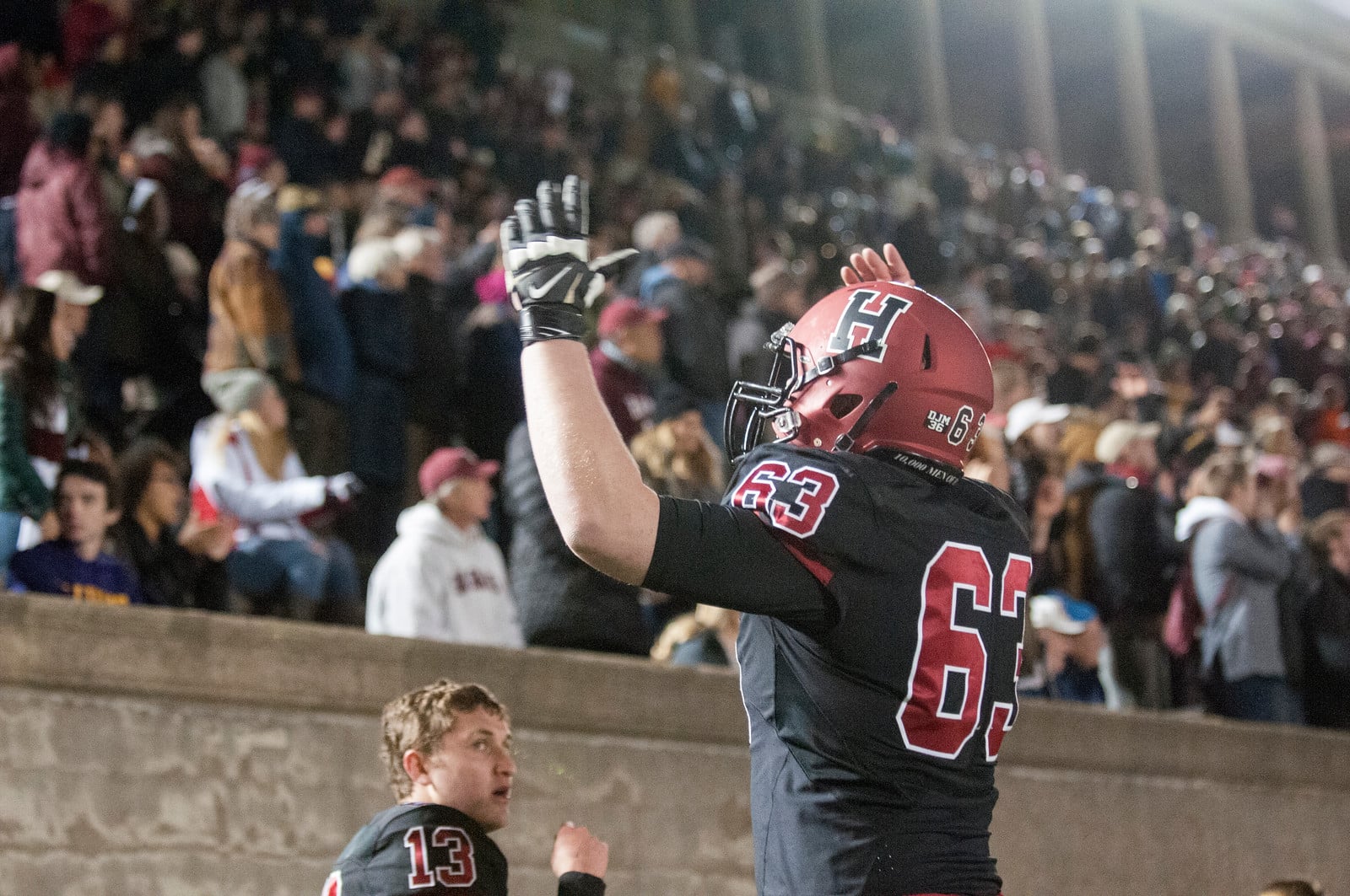 Junior offensive lineman Christian Shigley joins in on the celebration after Harvard's stunning comeback.