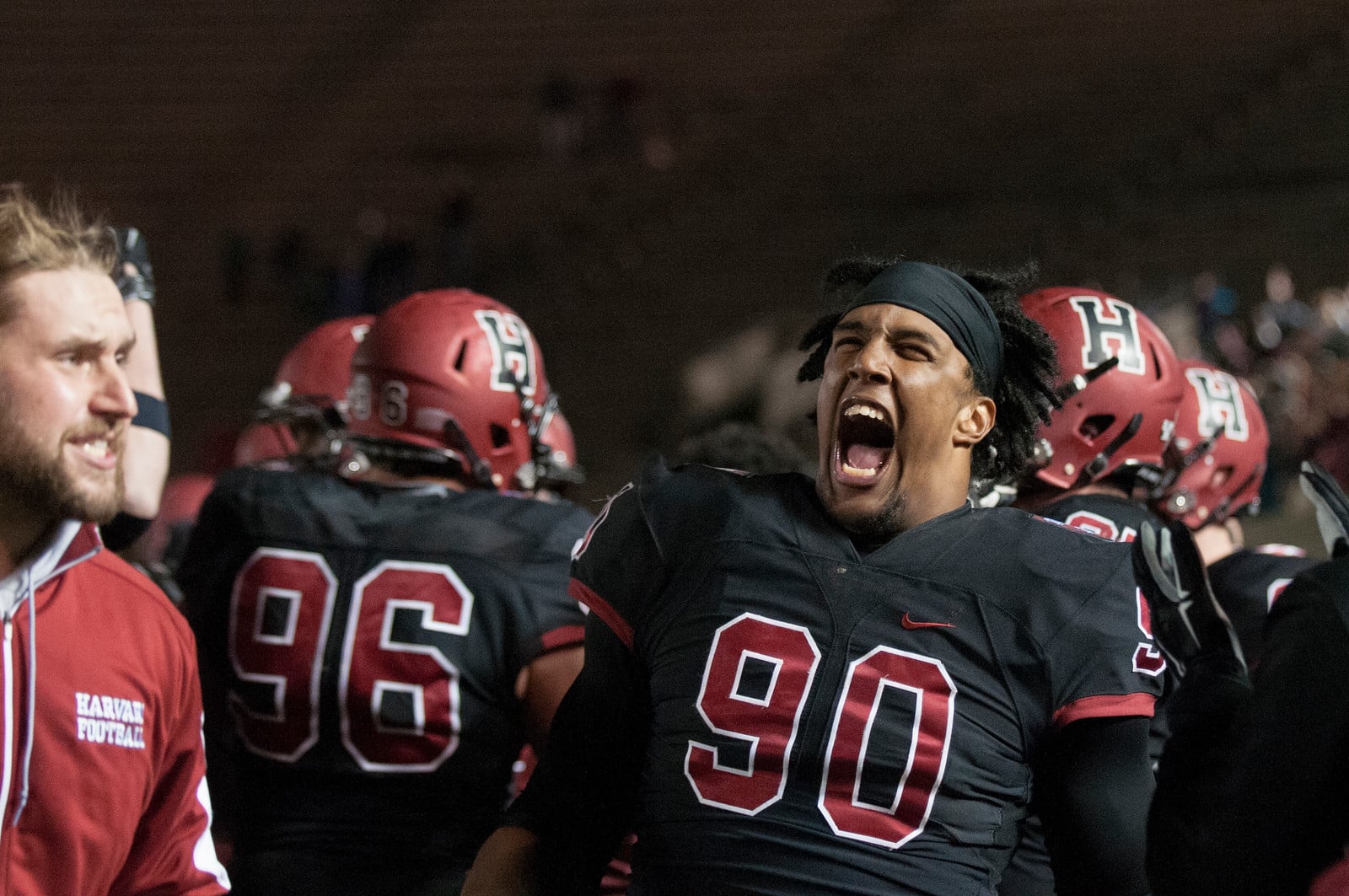 Sophomore defensive lineman Stone Hart celebrates on the sideline. Hart blocked Dartmouth's field goal at the end of the game to ensure the Crimson's 14-13 victory.